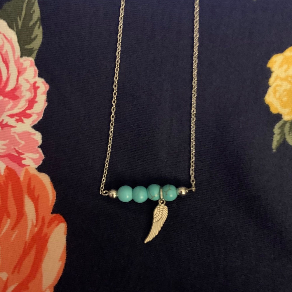Ladies Turquoise and Wing Earring